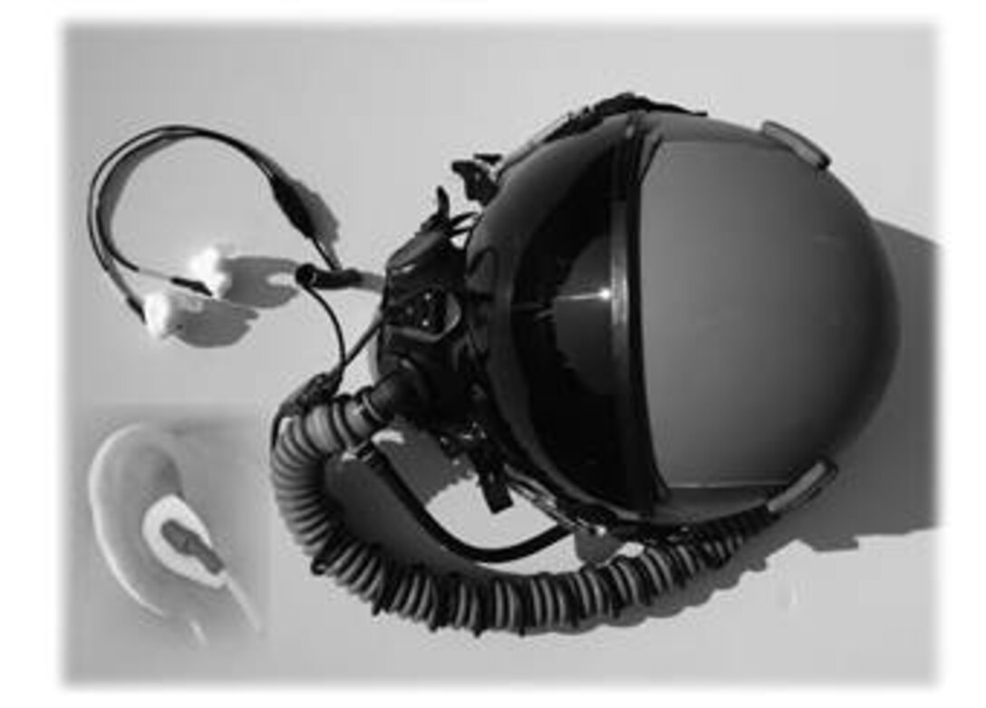 New custom earpiece shown here to be used with the headset...in hopes of replacing the headset currently being worn. (USAF photo illustration by Tech. Sgt. Sherri Savant)