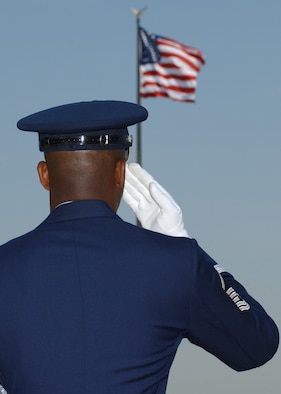 MSgt Eugene Brown, 514th Air Mobility Wing Honor Guard McGuire Air Force Base, N.J. renders a salute during the playing of the National Anthem a wreath during the Parade of Wreaths. This ceremony honored American men and women from all services who have given their lives in the name of peace, freedom, and justice.  This year's ceremony recognized the tragedy of the September 11th terrorist attacks.  This photo was taken on May 24, 2002, McGuire Air Force Base, N.J. 