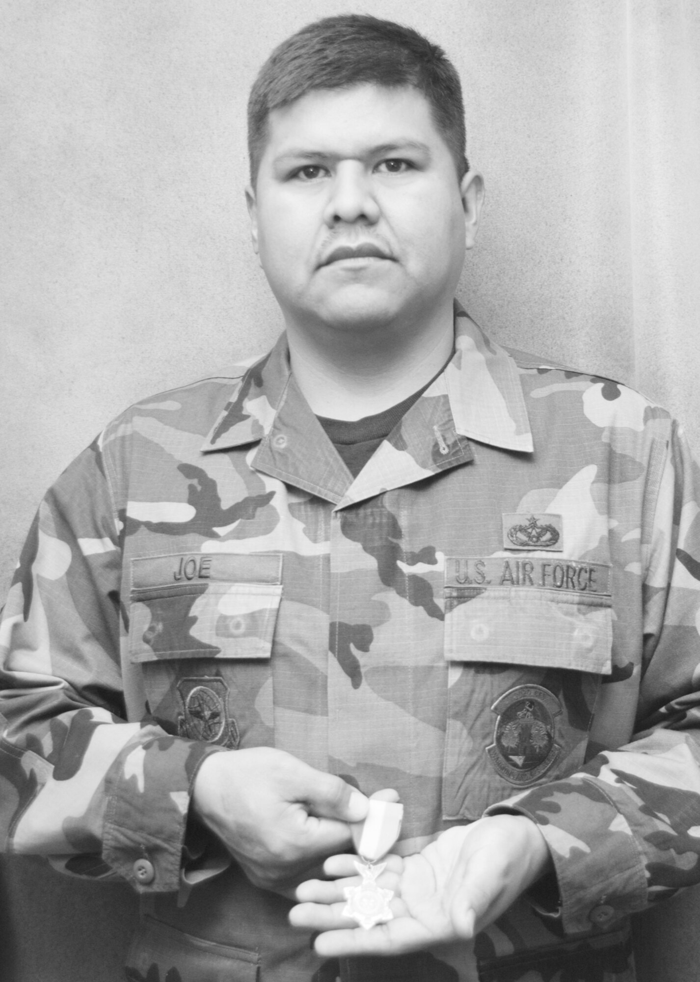 PETERSON AIR FORCE BASE, Colo (AFRC) -- Master Sgt. Melvin Joe, 302nd Civil Engineer Squadron assistant supervisor and NCO in charge of heavy equipment, recently received the Navajo Nation Service Medal.  The NNSM is a medal awarded by the Navajo Nation to Navajos serving in the U.S. military.  (U.S. Air Force photo by Tech. Sgt. Tim Taylor)