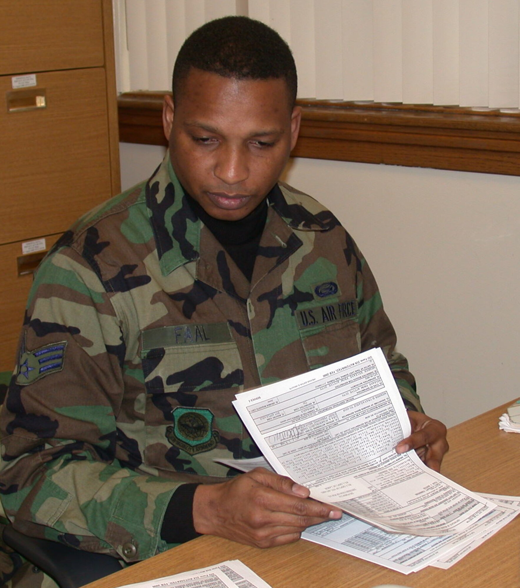 Senior Airman Papa Faal, a 459th Military Personnel Flight relocations specialist, became a U.S. citizen on December 6, 2005.  He is originally from The Gambia, a small West African country covering an area of no more than 4,400 square miles. (Air Force Photo by Capt. Nikki Credic)