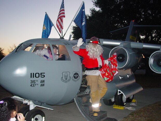 CHARLESTON AIR FORCE BASE, S.C. - Santa trades in his eindeer team for his surprise visit in the "Spirit of Hope, Liberty & Freedom" C-17 replica during the annual Christmas tree lighting ceremony.  (USAFR photo by Lt Capps)