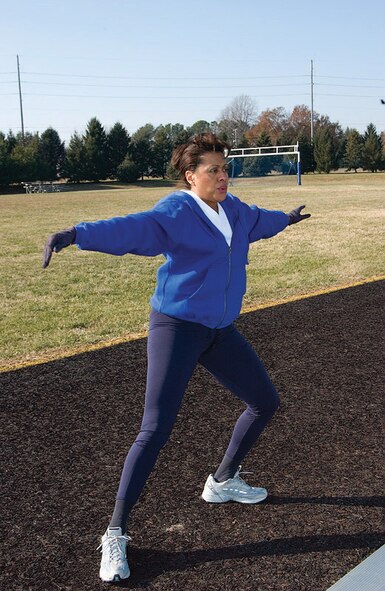 DOVER AIR FORCE BASE, Del. -- Maj. Dawn Crews-Seams, 512th Airlift Wing executive officer, warms up for her afternoon run at the Dover Air Force Base track. The 512th AW is an Air Force Reserve Command unit. (U.S. Air Force photo by Doug Curran)
