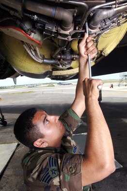ANDERSEN AIR FORCE BASE, Guam -- Senior Airman Raymond Gomez changes the anti-ice valve on a B-52 Stratofortress aircraft engine. Airman Gomez is a jet engine mechanic with the 2nd Maintenance Squadron at Barksdale Air Force Base, La. (U.S. Air Force photo Staff Sgt. Bennie Davis III)