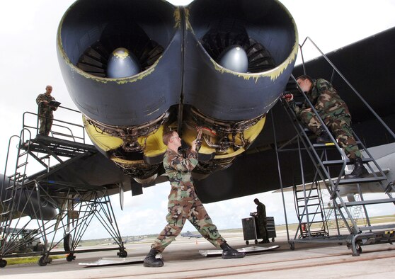 ANDERSEN AIR FORCE BASE, Guam (AFPN) -- Staff Sgt. Josh Cormier (left) Staff Sgt. Nick Grady (center), Senior Airman Raymond Gomez (back) and Staff Sgt. Tim Burnside do a phase inspection on a B-52 Stratofortress aircraft here. The Airmen are with the 2nd Maintenance Squadron at Barksdale Air Force Base, La. (U.S. Air Force photo by Master Sgt. Val Gempis)