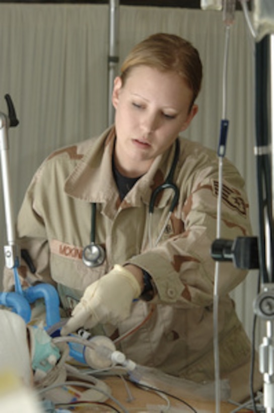 U.S. Air Force Staff Sgt. Bonnie McKinley checks the respiration of an Iraqi soldier receiving care at the Air Force theater hospital on Balad Air Base, Iraq, on Jan. 6, 2006. McKinley is a respiratory therapist deployed to Iraq from Sheppard Air Force Base, Texas. 