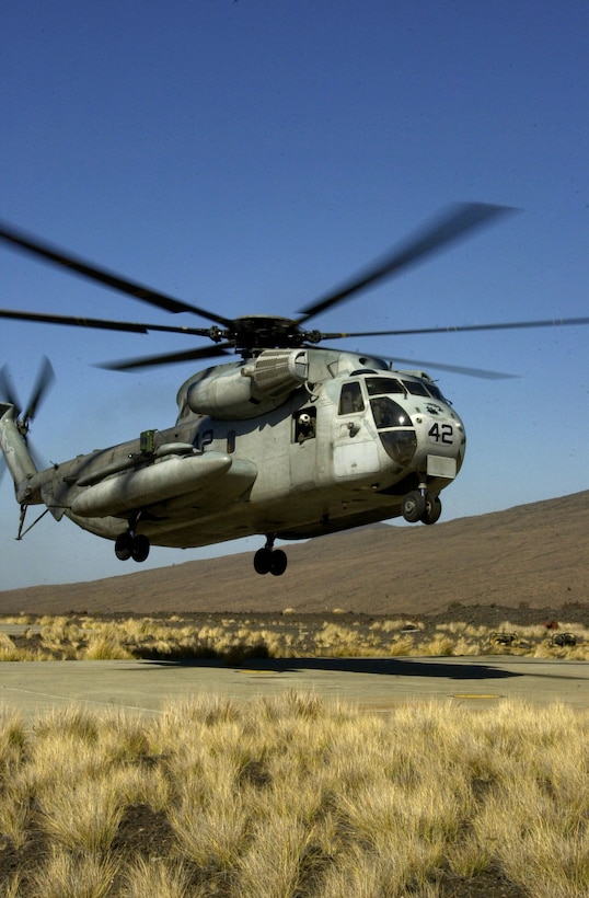 MARINE CORPS BASE HAWAII, KANEOHE BAY (Jan. 12, 2006) -- Alongside the Mauna Kea mountain, a CH-53D transport helicopter with Heavy Helicopter Squadron 363, Marine Aircraft Group 24, prepares to land for refueling during a Hawaii Combined Arms Exercise taking place this month in Pohakuloa Training Area, Hawaii. Meaning "white mountain," Mauna Kea is just one of the mountains near PTA where the Marines will train in maneuvers and combat tactics. Units participating in the exercise include MAG-41, MAG-24, Combat Service Support Group 3, and the 3rd Marine Regiment. (U.S. Marine Corps photo by Sgt. Joel A. Chaverri)