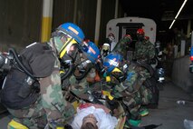 LANDOVER, Md-Medical personnel with the Chemical Biological Incident Response Force Company B triage a casualty during a simulated weapons of mass destruction attack at the Landover Metro Training Facility May 12.  CBIRF's medical personnel are trained, like their counterparts in Operations Iraqi and Enduring Freedom, to make life and death decisions in chaotic environments.