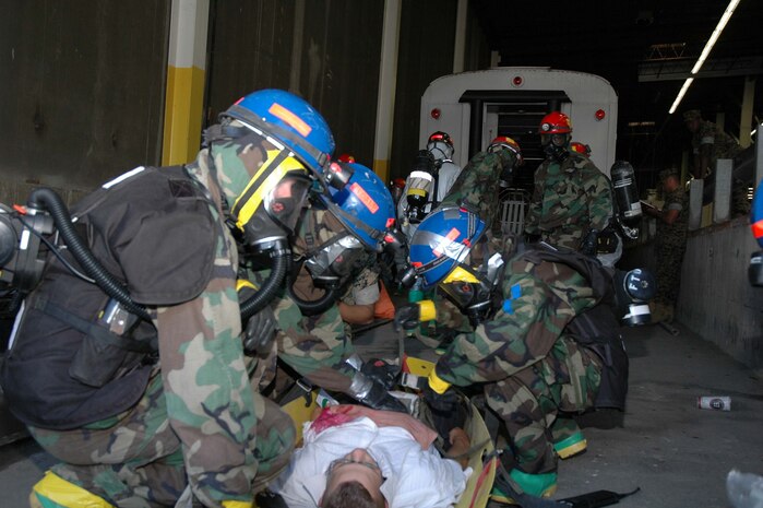LANDOVER, Md-Medical personnel with the Chemical Biological Incident Response Force Company B triage a casualty during a simulated weapons of mass destruction attack at the Landover Metro Training Facility May 12.  CBIRF's medical personnel are trained, like their counterparts in Operations Iraqi and Enduring Freedom, to make life and death decisions in chaotic environments.