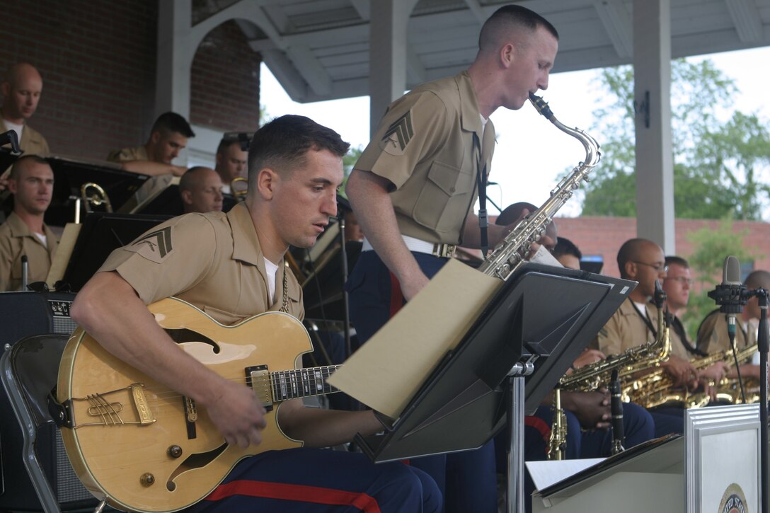 JACKSONVILLE, N.C. - Musicians from the 2nd Marine Division's and 2nd Marine Aircraft Wing's bands boogie the evening away in downtown Riverwalk Park here May 13.  The warriors formed an outfit unofficially called the II Marine Expeditionary Force band and entertained hundreds of local citizens with a jazz, swing and classic rock concert.
