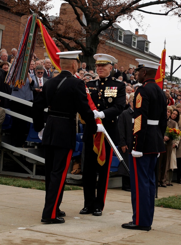 MARINE BARRACKS WASHINGTON - Gen. Michael W. Hagee presents Gen. James T. Conway with the Marine Corps Battle Colors and relinquishes his command as Commandant of the Marine Corps Nov. 13