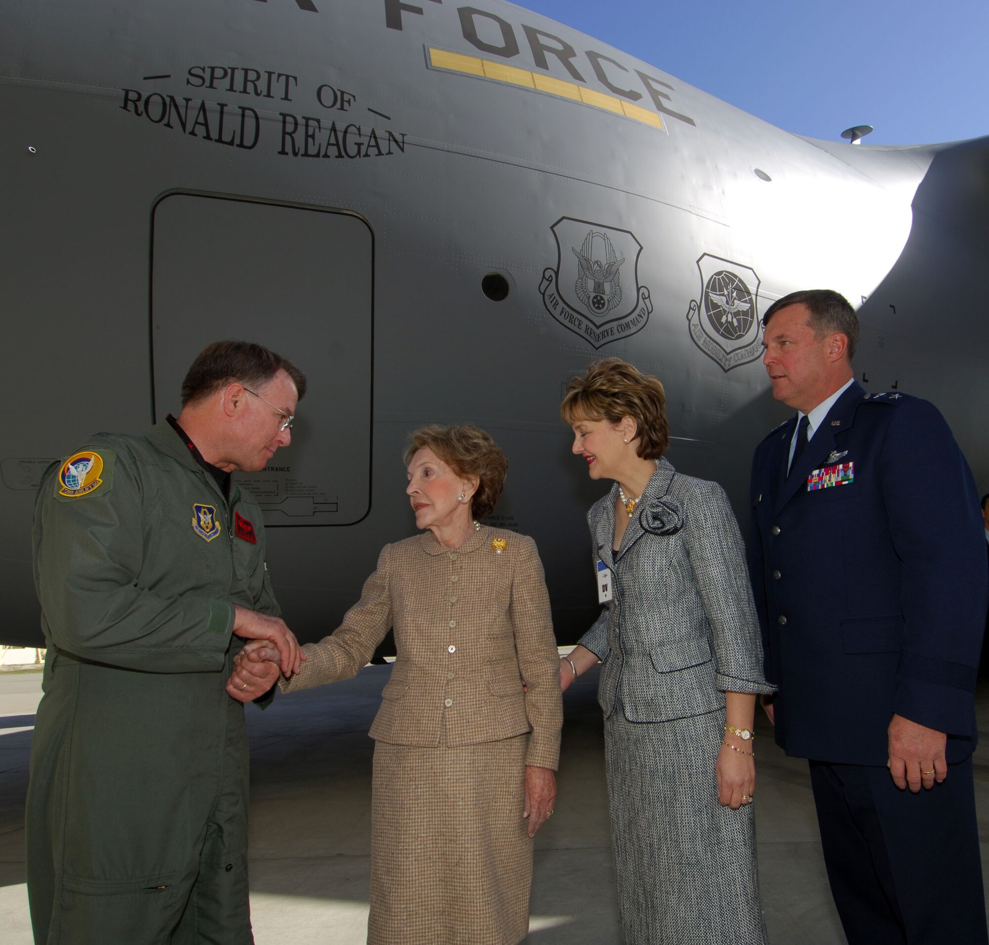 MARCH AIR RESERVE BASE, Calif. (AFPN) -- Lt. Gen. John Bradley shakes Nancy Reagan's hand after landing the C-17 Globemaster III aircraft the Air Force dedicated today in honor of her late husband, President Ronald Reagan. The general's wife, Jan, and 4th Air Force commander Maj. Gen. Robert E. Duignan also attended the dedication of The Spirit of Ronald Reagan. General Bradley is chief of the Air Force Reserve and commander of Air Force Reserve Command. (Courtesy photo)