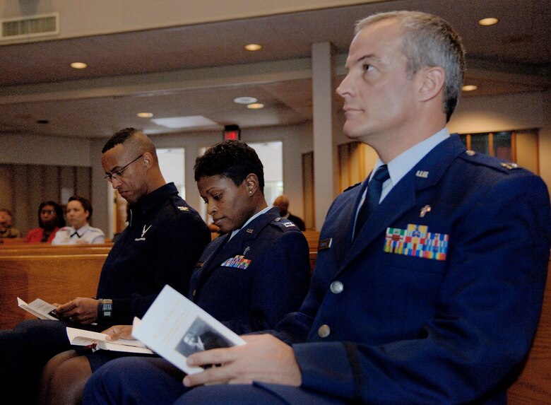 LACKLAND AIR FORCE BASE, Texas (AFPN) -- Chaplain (Capt.) James Janecek (right) and Chaplain (Capt.) Regina Samuel, and Col. Gerard Joliuette, listen to Chaplain (Retired Col.) Albert Hockaday, during the Dr. Martin Luther King, Jr. 2006 Commemorative Service at the Freedom Chapel here. Captains Janecek and Samuel are chaplains with the 37th Training Wing. Colonel Joliuette is the commander of the 37th Technical Training Group and retired-Colonel Hockaday was the guest speaker at the ceremony. (U.S. Air Force photo by Tech. Sgt Larry A. Simmons)