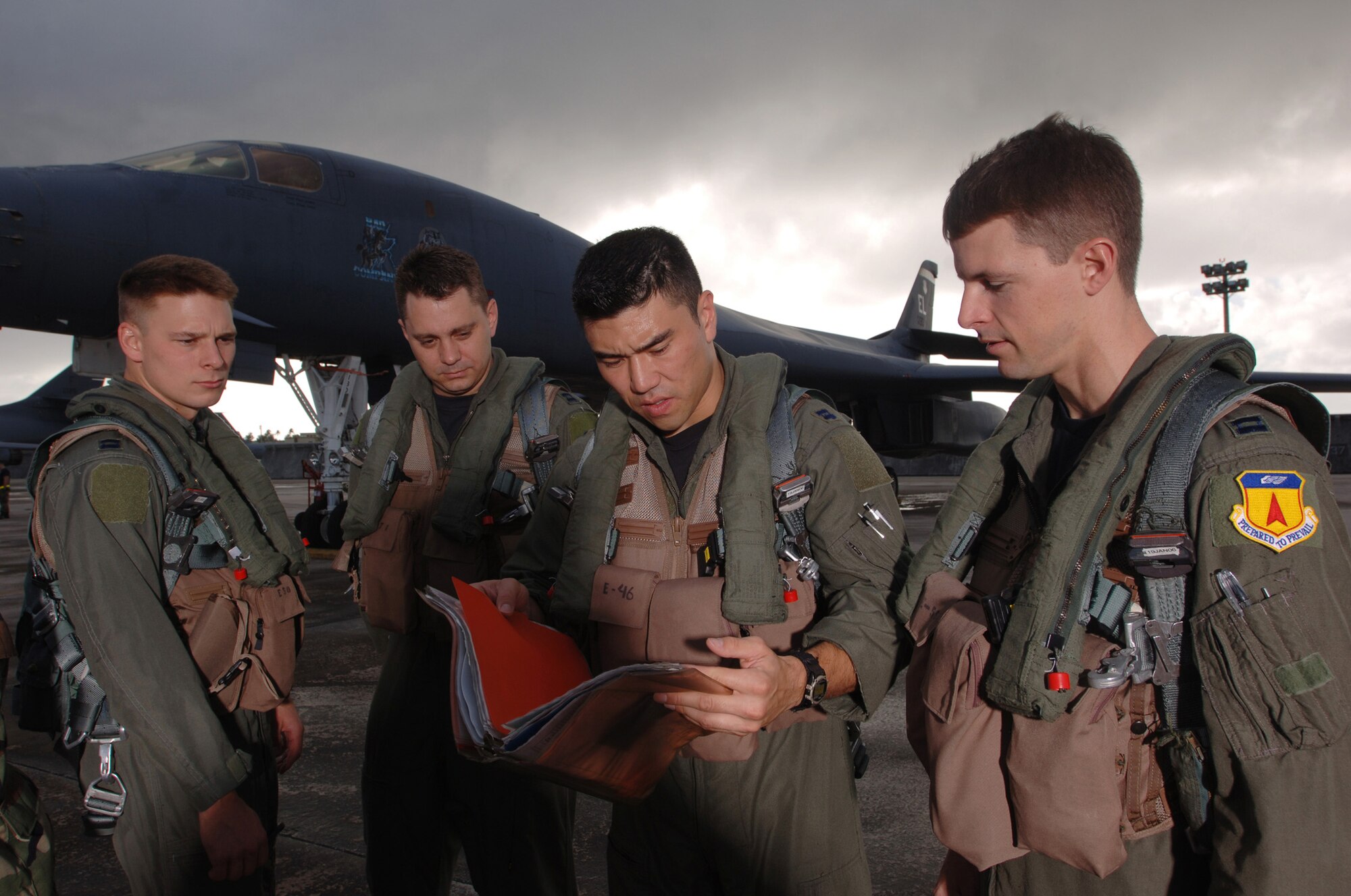 ANDERSEN AIR FORCE BASE, Guam (AFPN) -- (From left) Capts. Cliff Chapman, Ray Benson, Ivin Vian and Ryan Sweeney conduct a briefing before a morning sortie. The Airmen are B-1B Lancer aircrew members from the 34th Bomb Squadron at Ellsworth Air Force Base, S.D. The unit is here to provide the U.S. Pacific Command a continuous bomber presence in the Asia-Pacific region. (U.S. Air Force photo by Master Sgt. Val Gempis)