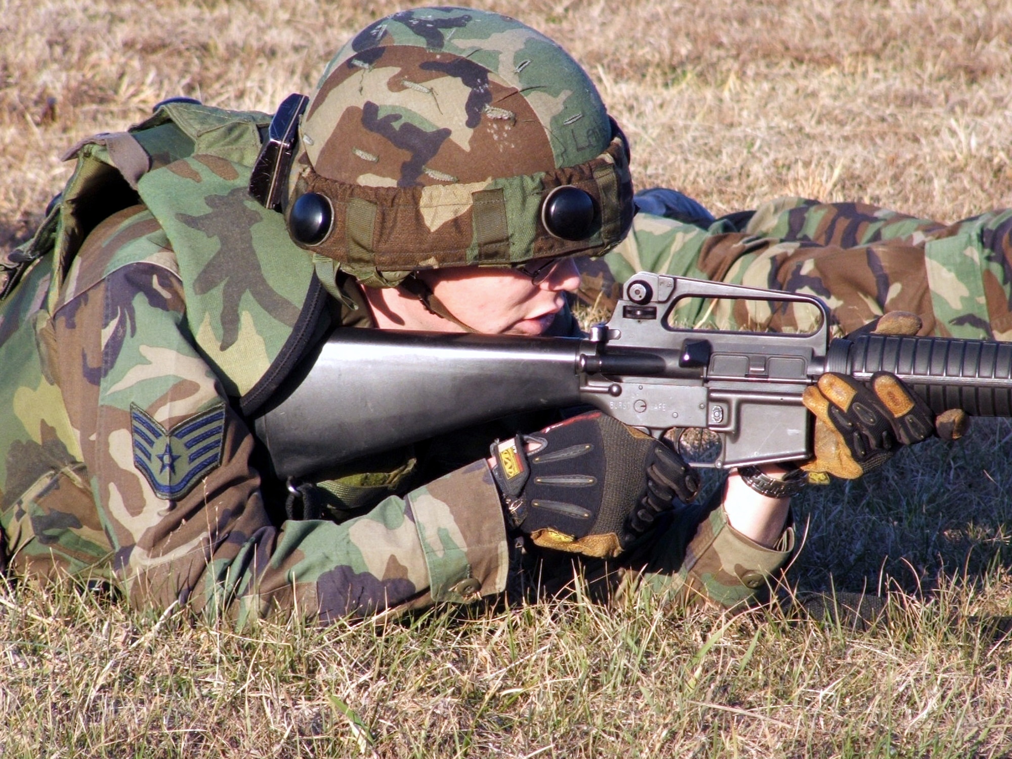 FORT DIX, N.J. (AFPN) -- Staff Sgt. Brenden Leahy takes up a position during a combat patrol and tactics training session Jan. 12 More than 100 students from multiple career fields participate in the Air Force Integrated Contingency Skills Training Course. In the course, Airmen learn everything from combat tactics and patrolling to convoy operations and combat first aid. The course is directed and taught by the Air Mobility Warfare Center's 421st Combat Training Squadron. Sergeant Leahy is with the 816th Contingency Response Group at McGuire Air Force Base, N.J. (U.S. Air Force photo by Tech. Sgt. Scott T. Sturkol)
