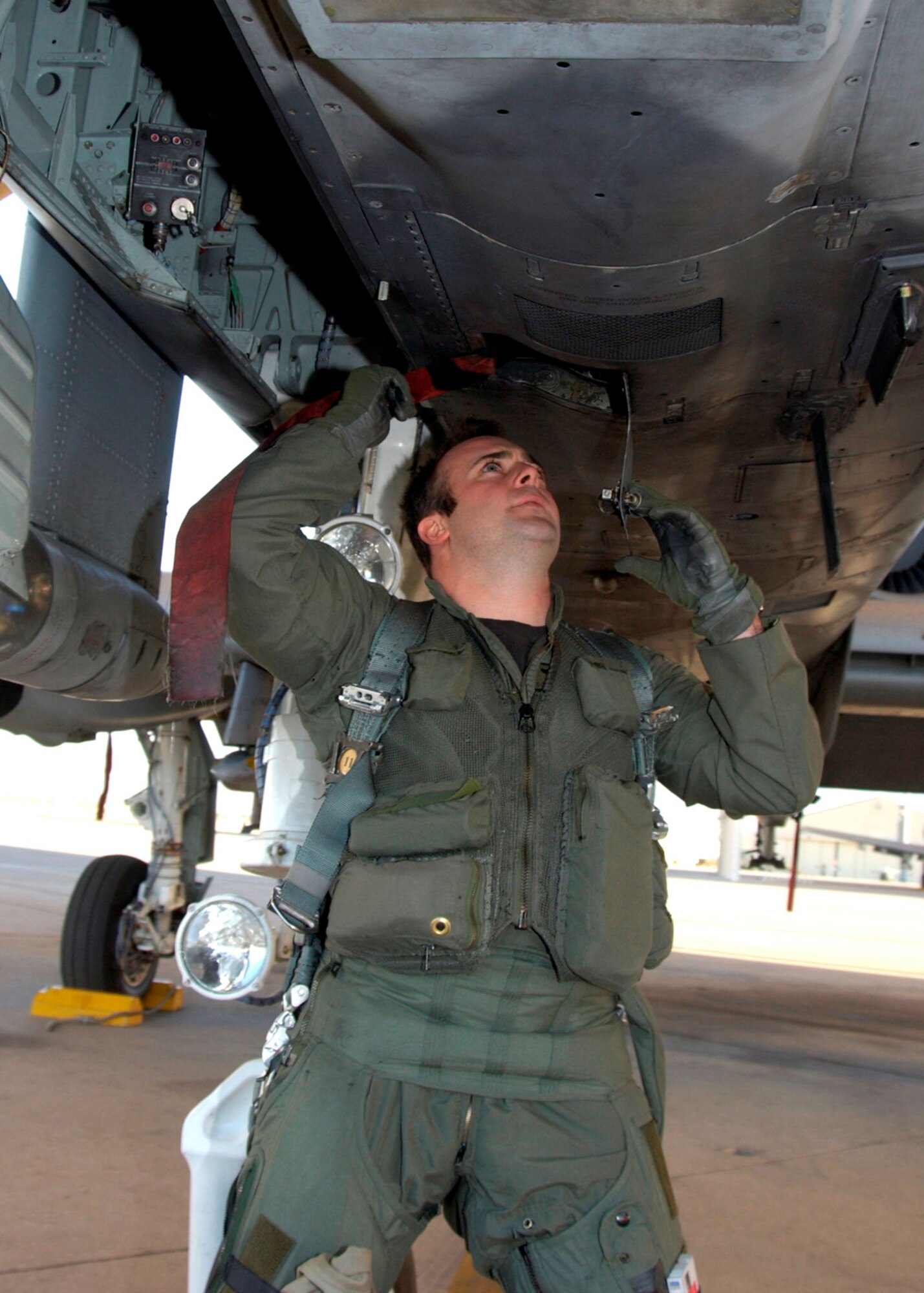 DAVIS-MONTHAN AIR FORCE BASE, Ariz. (AFPN) -- Capt. Scott Michalowski does a preflight inspection before takeoff. The 357th Fighter Squadron continuously trains for real world deployment situations. Captain Michalowski is a pilot with the 357th FS. (U.S. Air Force photo by Airman 1st Class Veronica Pierce)