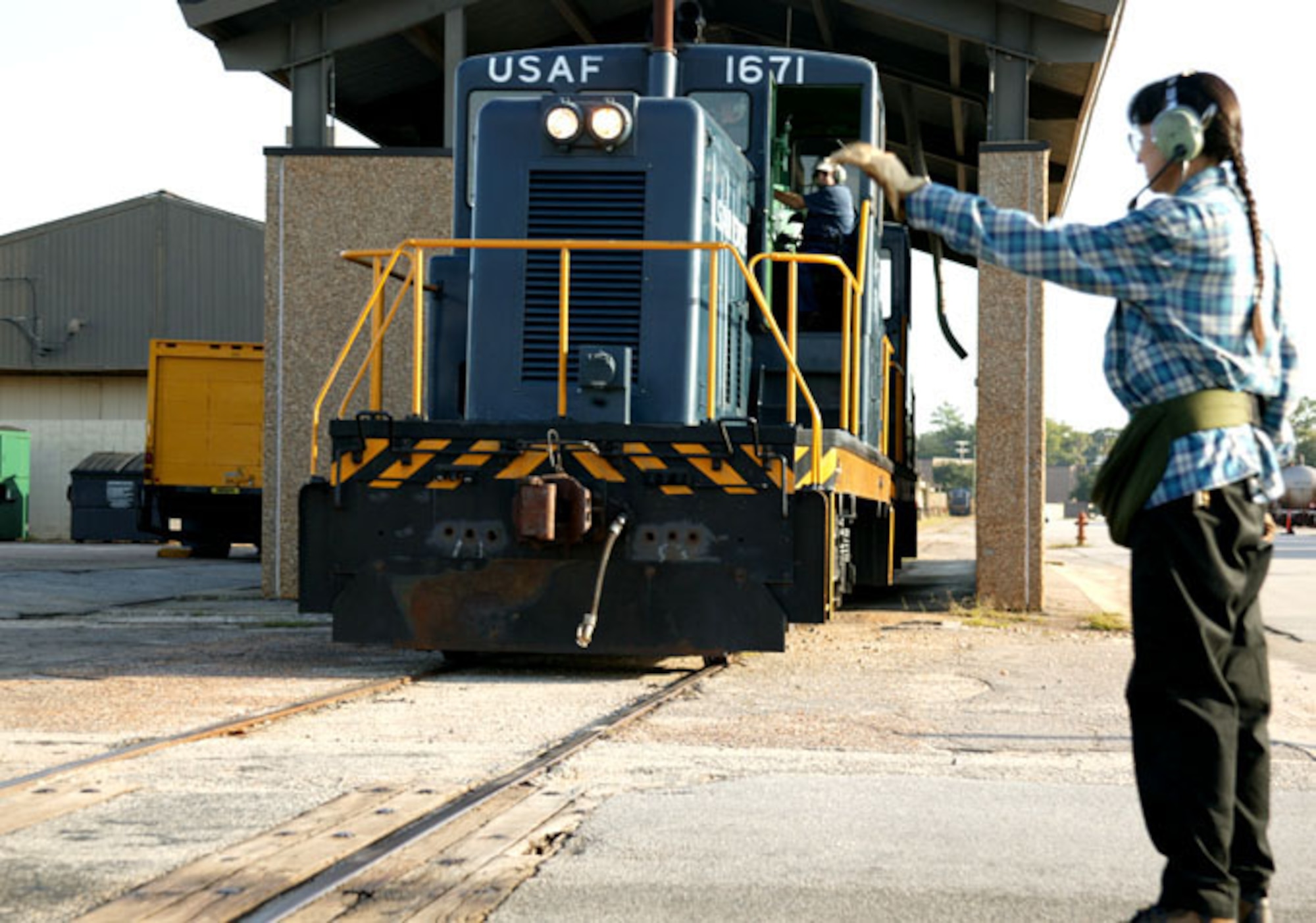 SHAW AIR FORCE BASE, S.C. (ACCNS) -- Ms. Michele Hill, train conductor, and Mr. Thomas Scher, engineer, move one of two 80-ton locomotives used to deliver Jet Petroleum-8 to the fuels management flight here. The base's rail operation has been active since 1941. (U.S. Air Force by 1st Lt. Suzanne Ovel)