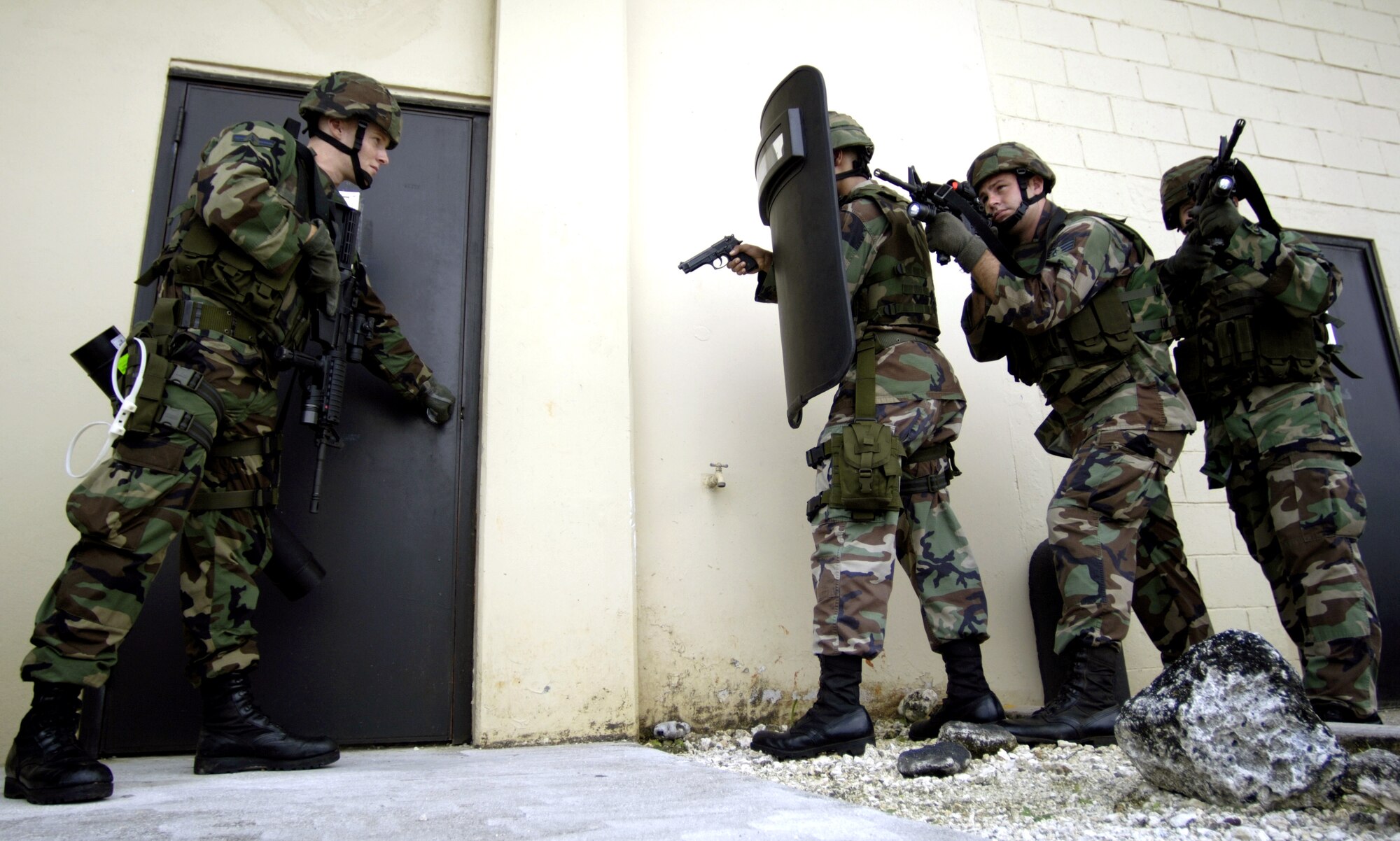 ANDERSEN AIR FORCE BASE, Guam (AFPN) -- Airmen from the 613th Security Forces Squadron practice building entrance tactics during an exercise. The squadron is part of the 613th Contingency Response Group. It is changing its designation Jan. 19, after which it will be the 36th CRG.  The Airmen conducted this training Jan. 9. (U.S. Air Force photo by Tech. Sgt. Shane A. Cuomo)
