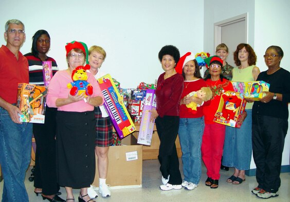 Volunteers from Homestead Air Reserve Base, Fla. gathered gifts to deliver to children at local migrant camps.  The tradition started seven years ago.  This year they gave presents to more than 250 kids.  (US Air Force Reserve photo by Lisa Macias)