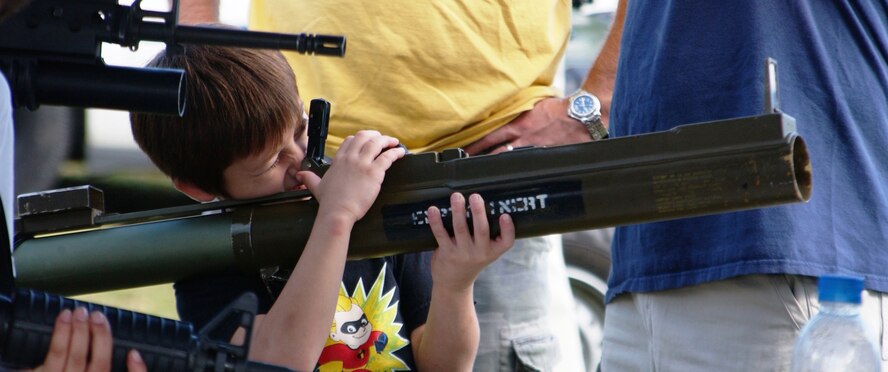 During the family day festivities at Homestead ARB on Dec. 4, children were treated to weapons displays from the 482nd Security Forces Squadron.  The children also got a visit from Santa, played in the 'bounce house', and had their faces painted by a few clown volunteers from the base (U.S. Air Force Reserve photo by Senior Airman Sandra Bueno).                     