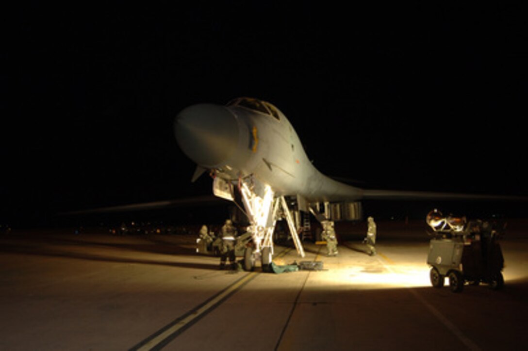 U.S. Air Force crew chiefs from the 7th Maintenance Operations Squadron and the 9th Bomb Squadron prepare a B-1B Lancer aircraft for a mission during an operational readiness exercise at Dyess Air Force Base, Texas, on Jan. 11, 2006. The readiness exercise is design to improve war-fighting skills. 