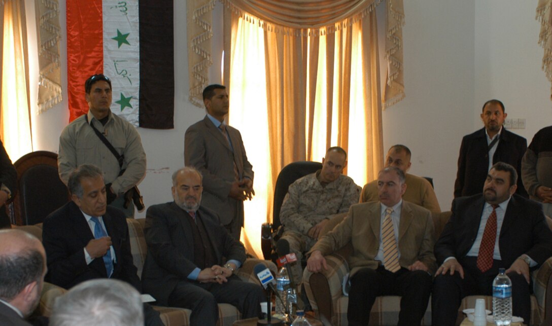 AR RAMADI, Iraq - U.S.  Ambassador Zalmay Khalilzad (left) and  Iraqi Prime Minister Ibrahim Ja'afari (center left) met with the al Anbar Governor, Ma'amoun Sami Rashid (right), Minister of Industry and Minerals Osama Al Najafi (center right), Coalition Forces and members of the Anbar Security Council, Jan. 15 to discuss the future of Al Anbar. This discussion included Anbar's participation in the Iraqi Security Forces, combating terrorism throughout the province, the role of the Coalition Forces and Al Anbar's participation in the new Iraqi government.