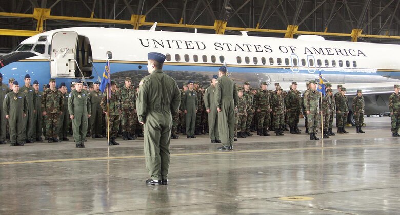 The mighty C-9C, used for Operational Support Airlift, sits behind part of the 932nd Airlift Wing as the reservists prepare for commands to be called out.  Photo by TSgt. Daniel Oliver, 932nd AW/PA.