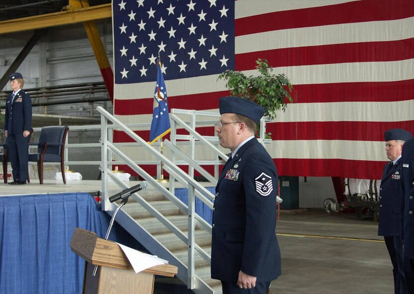 MSgt. David Ernst prepares to sing the national anthem at Col. Maryanne Miller's change of command event.