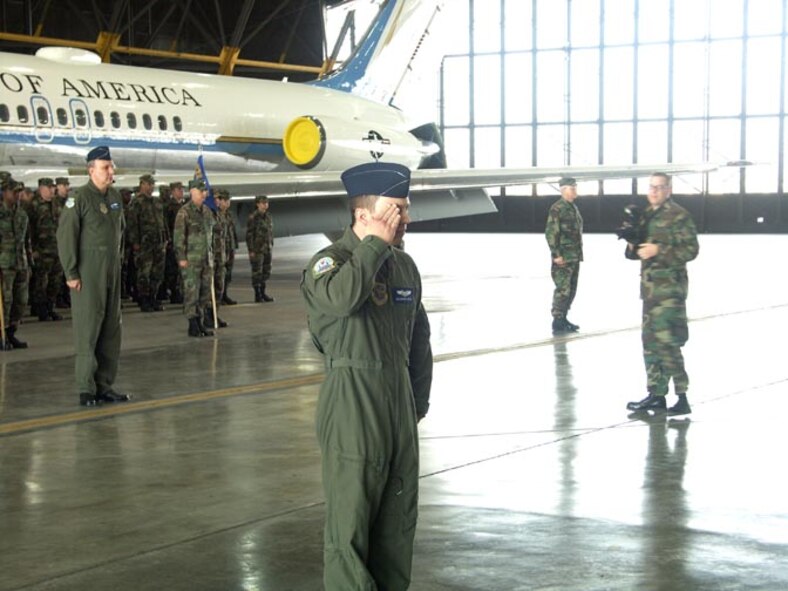 The leader of the 932nd Airlift Wing troop formation salutes as the change of command begins in January.  Col. Maryanne Miller took command from Col. Donald Fletcher Jr.