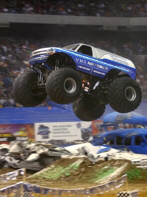 SAN ANTONIO -- Afterburner, the Air Force's new monster truck, flies over cars at the San Antonio Monster Jam, Jan. 14. Afterburner, driven by Paul Cohen, made the finals Jan. 14, but was edged out by Grave Digger in the final match. (U.S. Air Force photo by Senior Airman Brian Ferguson)