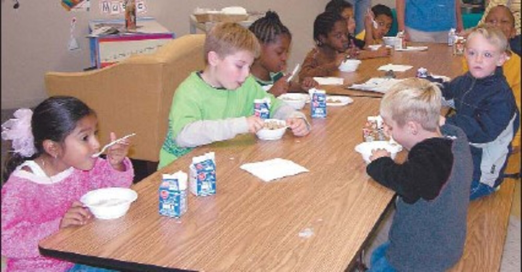 Tuesday, children enjoy a snack in the new youth center multi-purpose room. The
newly opened addition offers equipment and space to keep children active.