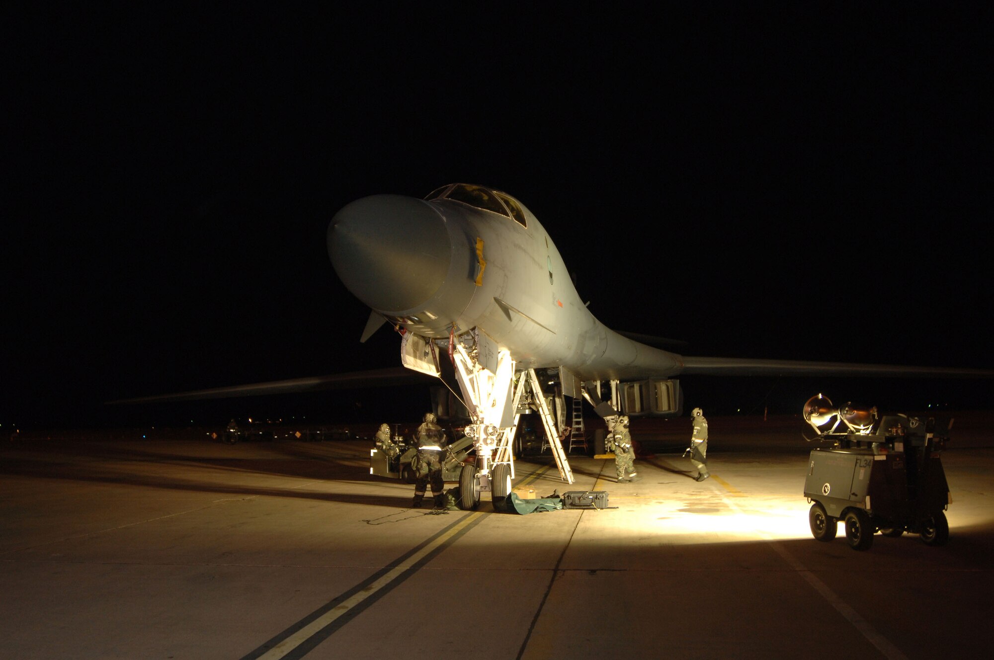 DYESS AIR FORCE BASE, Texas (AFPN) -- Crew chiefs prepare a B-1B Lancer for a mission during an operational readiness exercise. The Airmen are with the 7th Maintenance Operations Squadron and the 9th Bomb Squadron here. The exercise prepares Airmen for the upcoming operational readiness inspection and wartime deployments. (U.S. Air Force photo by Airman 1st Class Ryan Summers)
