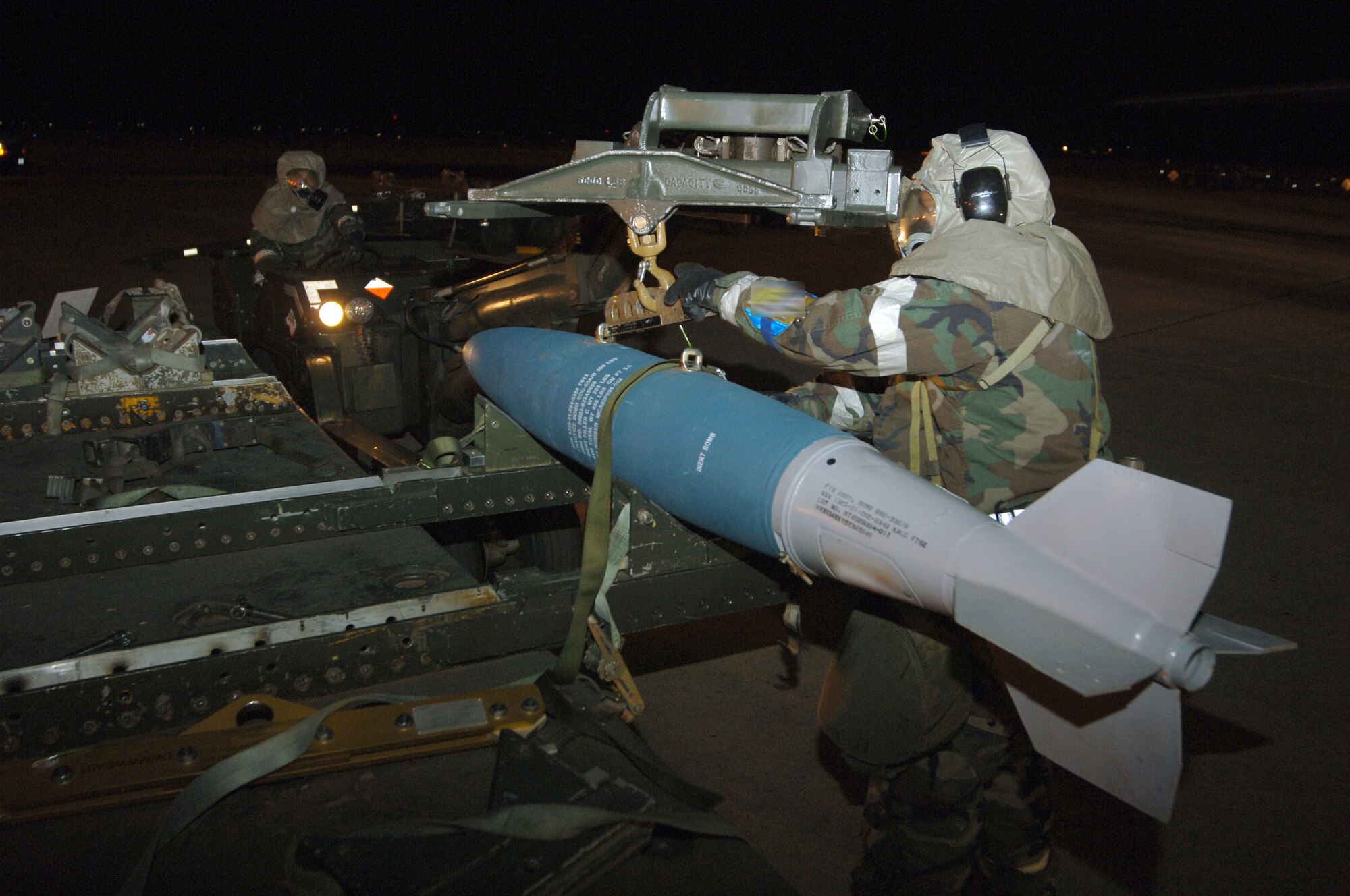 DYESS AIR FORCE BASE, Texas (AFPN) -- Airmen load inert bombs onto a B-1B Lancer during an operational readiness exercise. The Airmen are with the 7th Maintenance Operations Squadron and the 9th Bomb Squadron here. The exercise prepares Airmen here for the upcoming operational readiness inspection and wartime deployments. (U.S. Air Force photo by Airman 1st Class Ryan Summers)