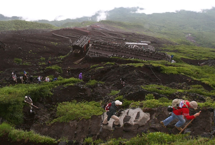 Station Marines and sailors climb up the biggest mountain in Japan, Mount Fuji, during a Single Marine Program trip to Tokyo July 17. The Marines started climbing the volcano at 4:30 a.m., and most made it back down by 1:00 p.m.