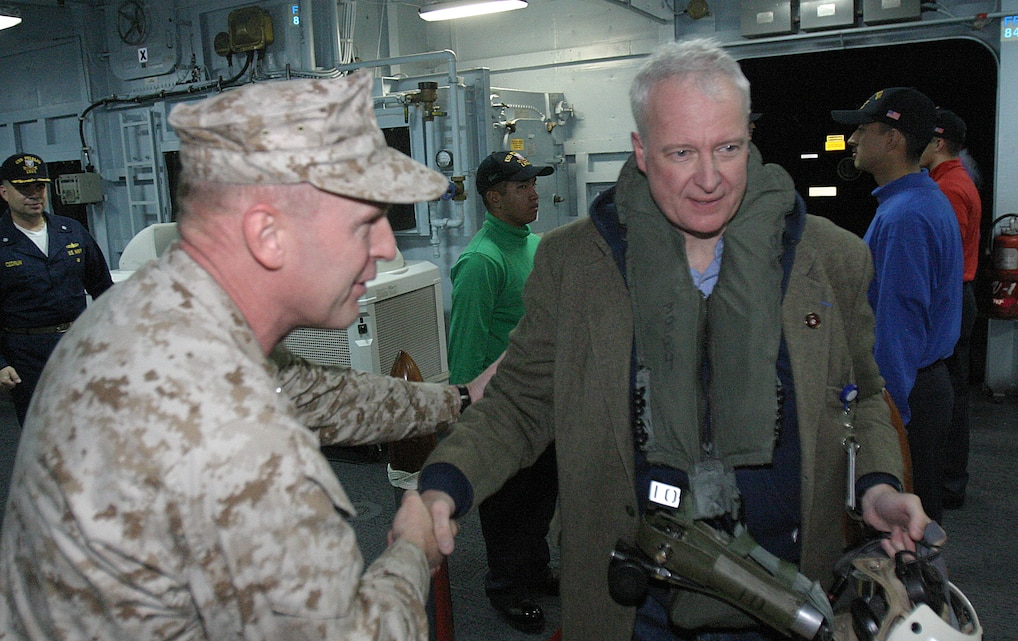 Brigadier Gen. Carl B. Jensen, Expeditionary Strike Group Three commander, greets Samuel Brock, senior advisor to the Assistant Secretary for International Organization Affairs, as he and other training members boarded the USS Peleliu, Jan. 17. Brock took part in the 11th Marine Expeditionary Unit's Joint Task Force Exercise training here as a consular general of a notional country.
