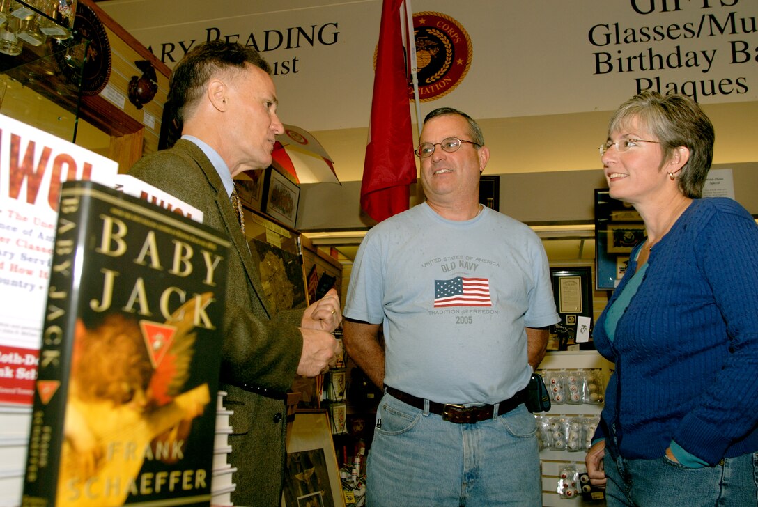 MARINE CORPS BASE CAMP LEJEUNE, N.C. ? Frank Schaffer, author of various books about the Marine Corps and recognized for his best seller ?Keeping Faith? signs his new book ?Baby Jack? at the Marine Corps Association Book Store here Oct 17. The book is a fictional story of a Marine born into a rich family and his struggle due to his decision. Michael and Joanne Ingram speak to Schaffer about their son Lance Cpl. Michael Ingram of Company D, 2nd Amphibious Assault Battalion, 5th Regimental Combat Team. ?We read ?Keeping Faith? while he was at boot camp and through his writing he has helped us through our son?s time away,? said Joanne Ingram. This tour is the second of three stops to Marine Corps bases; Schaffer?s next stop is the Marine Corps Recruit Depot Parris Island, S.C.