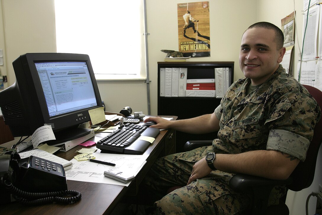 MARINE CORPS BASE CAMP LEJEUNE, N.C. -- Cpl. Antonio Ramos, a fiscal clerk with the 2nd Marine Division, is responsible for handling hundreds of military travel claims utilizing the Defense Travel System, or DTS.  The 26-year-old Bronx, N.Y., native says he gets much satisfaction taking care of Marines' administrative needs and showing them how to book their claims using this paperless system.