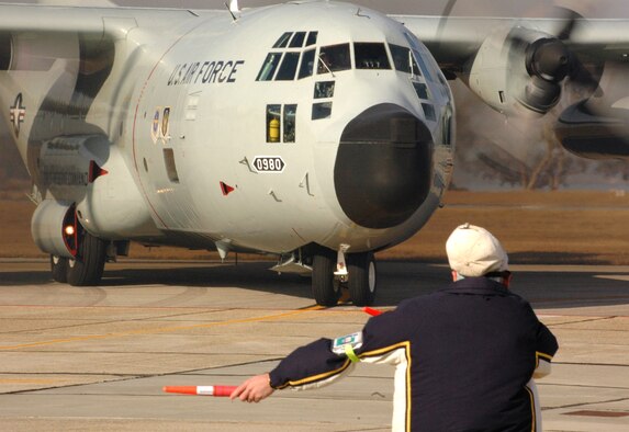 KEESLER AIR FORCE BASE, Miss. (AFPN) -- Senior Master Sgt. Richard Rivard taxis the final WC-130H aircraft out on the runway on its way to Willow Grove Air Reserve Station, Pa. Aircraft No. 980 was the last H-model aircraft to depart the 403rd Wing after its complete conversion to the WC-130J. Sergeant Rivard has served more than 20 years as a crew chief, mostly servicing H-models.  He is an air reserve technician with the 403rd Aircraft Maintenance Squadron, Keesler Air Force Base, Miss. (U.S. Air Force photo by Staff Sgt. J. Justin Pearce)