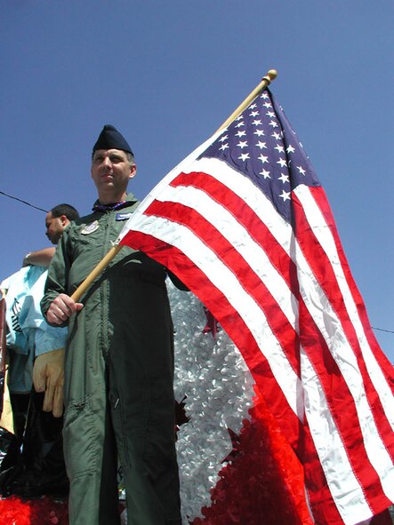 SMSgt. David Rainey waves the flag for all to see in the Memorial Day parade.  Want to be patriotic and join the Air Force Reserve?  Call 1-800-257-1212 for information.