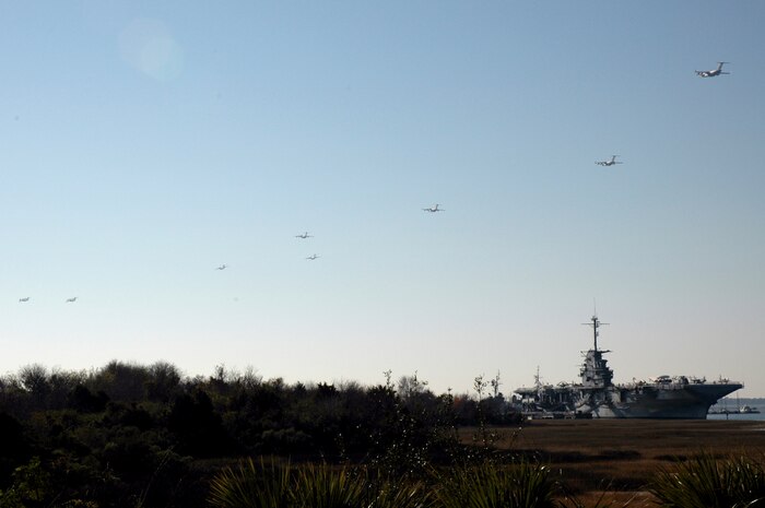 CHARLESTON AFB, S.C.--17 massive C-17's fly in formation over Charleston harbor and the historical USS Yorktown while on a record-breaking training mission. (Photo by 1Lt Wayne Capps, USAFR)