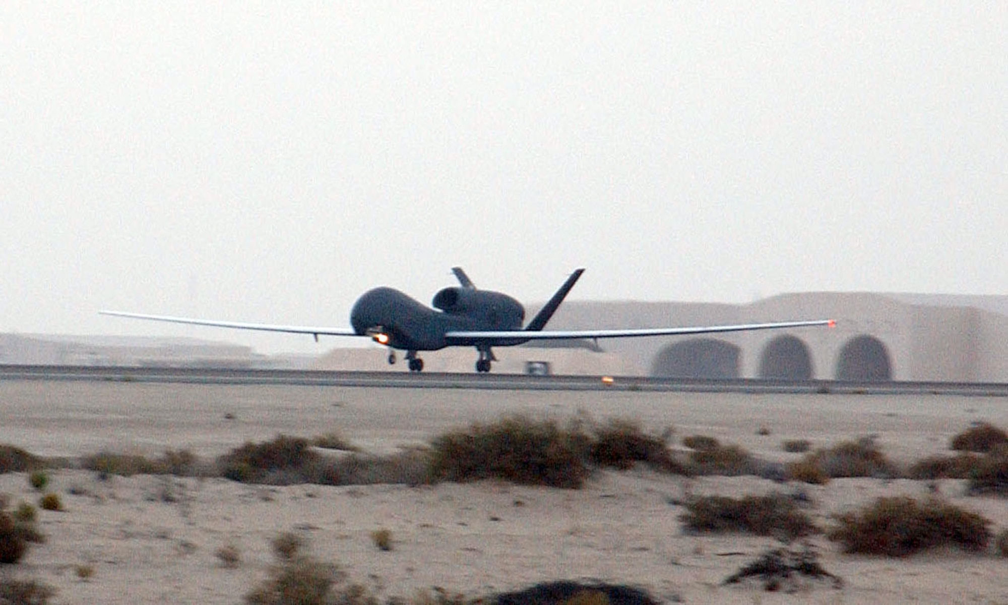 SOUTHWEST ASIA (AFPN) -- A Global Hawk taxis down the runway after landing at a desert base. The unmanned aerial vehicle is the Air Force's second deployed production Global Hawk. The two UAVs are the first production models deployed. Previous Global Hawks were prototypes or test models. (U.S. Air Force photo by Tech. Sgt. Mike Hammond)
