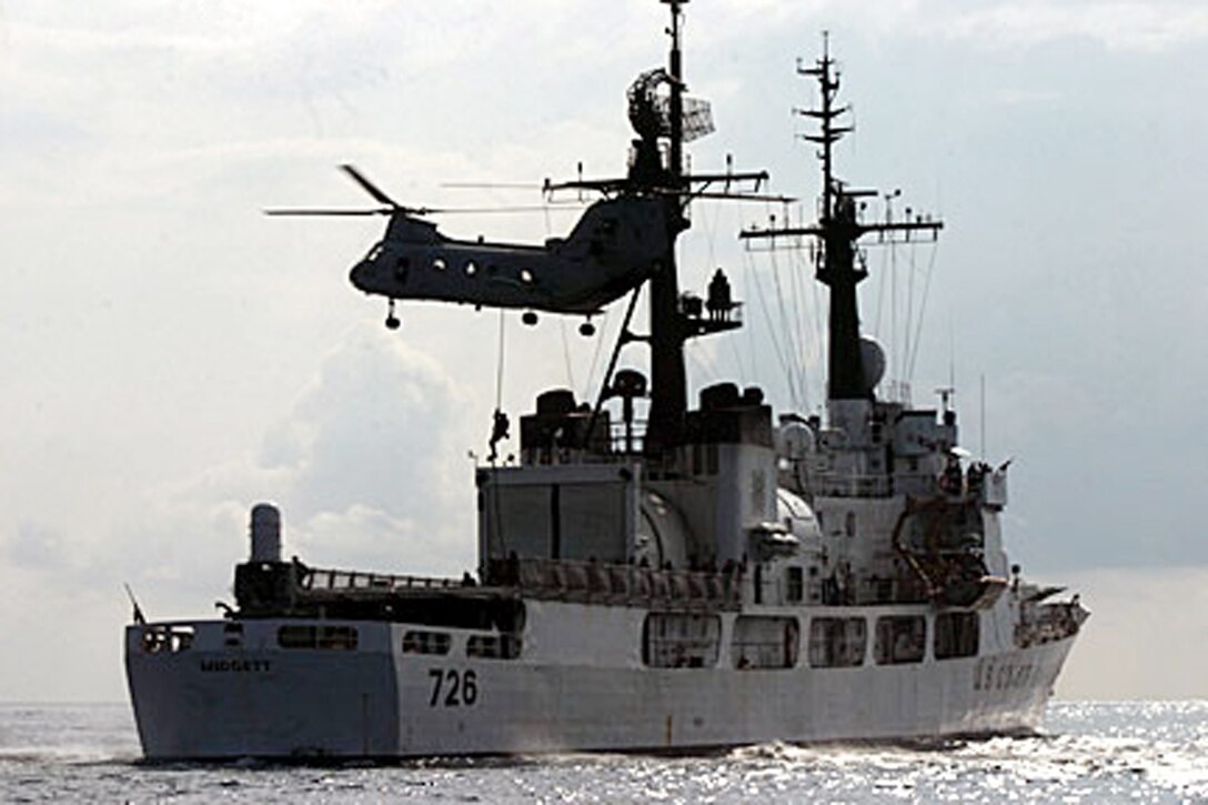 ABOARD USS DUBUQUE (LPD-8) (Oct 18, 2006)--A Marine from Maritime Special Purpose Force, 15th Marine Expeditionary Unit (Special Operations Capable), fast ropes from a CH-46E Seaknight onto the USCGS Midgett during a Visit, Search and Seizure exercise.  The 15th MEU (SOC), part of Expeditionary Strike Group 5 aboard the USS Boxer (LHD-4), USS Dubuque (LPD-8) and the USS Comstock (LSD 45), is currently deployed in the Western Pacific Region. (Official USMC Photo by Staff Sgt Alex Popescu) (Released)