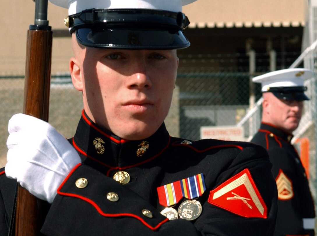 Pfc. Norris Atesiano, an administrative clerk for 1st Battalion, 3rd Marine Regiment currently serving in Afghanistan as part of Operation Enduring Freedom, keeps a steady watch on his post aboard Jalalabad Airfield. Atesiano came to the United States from his native Cuba when he was 14 and now considers Miami and America his home.