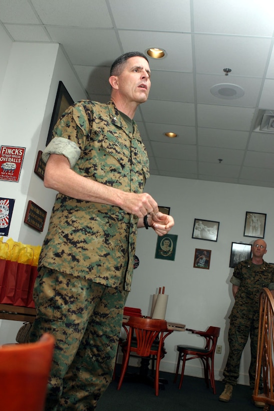 MARINE CORPS BASE CAMP LEJEUNE, N.C.(May 19) Col. Steve Davis, Commanding Officer, Regimental Combat Team-2, 2nd Marine Division speaks of the importance of the Key Volunteers before the awards ceremony at the Wooden Nickel restaurant at the Officer's Club here May 19. The mission of the key volunteers is to act as a support network for the wives of deployed spouses.