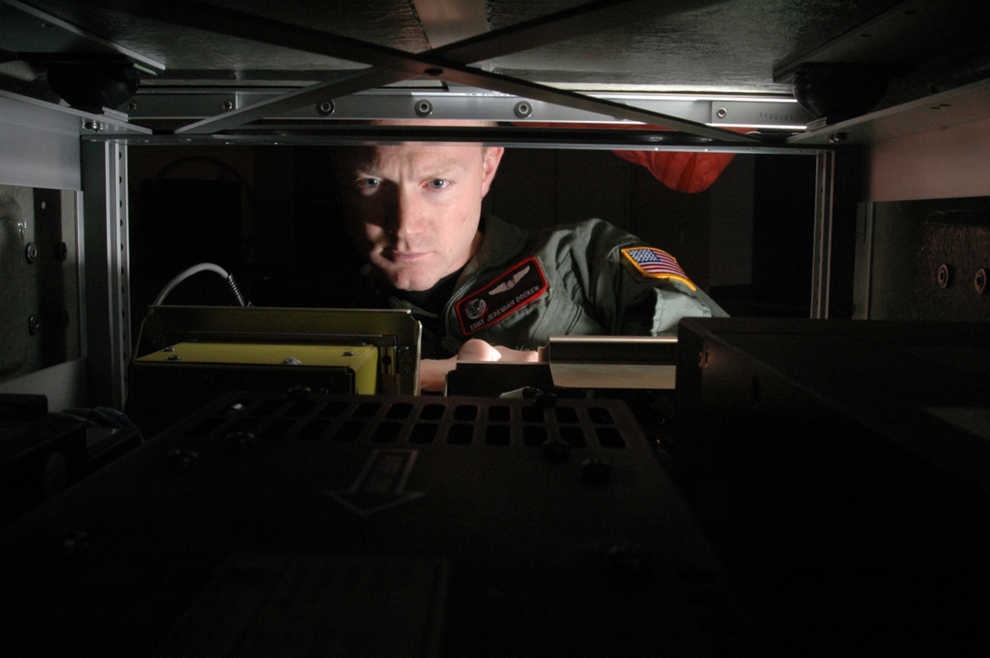 FAIRCHILD AIR FORCE BASE, Wash. (AFPN) -- Tech. Sgt. Jeremiah Docken loads data into a Roll-On Beyond Line-of-Sight Enhancement Spiral 2 kit as part of a training exercise Jan. 17. The upgraded ROBE Spiral 2 equipment brings enhancements to a system that is revolutionizing battlefield communications. Acting as a flying network node, the ROBE kits help forward data streams, voice and other information from units in the battle zone to satellites, which in turn can forward the information anywhere on the globe. Sergeant Docken is a boom operator with the 92nd Air Refueling Squadron. (U.S. Air Force photo by Staff Sgt. Nathan Gallahan) 