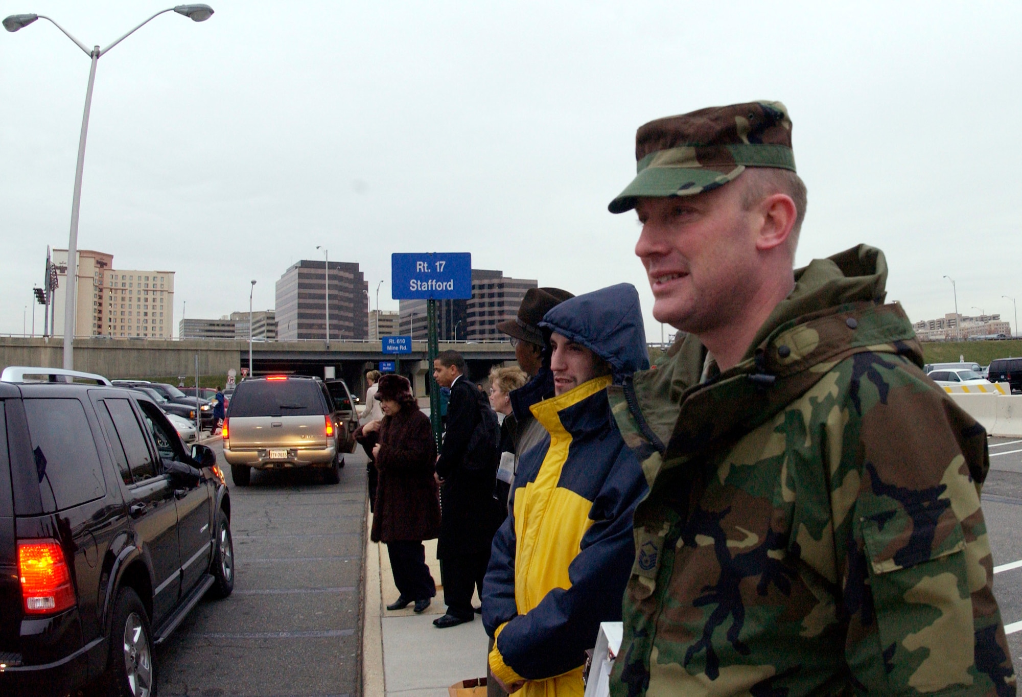 ARLINGTON, Va. (AFPN) -- Master Sgt. Roy Blanchard waits for a ride home Jan. 17 to Fredericksburg, Va. Commuters around the national capital region use "slug" lines to avoid traffic driving to and from work. People line up according to their destinations and drivers will pick up enough people to use the high occupancy vehicle lanes. It allows them to bypass traffic in their morning and afternoon commutes. (U.S. Air Force photo by Senior Airman J.G. Buzanowski) 
