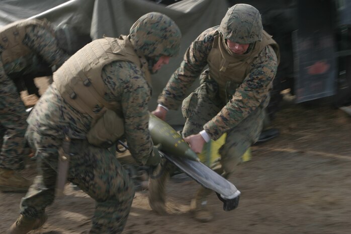 Marines from Sierra Battery, Battalion Landing Team 1st Bn., 8th Marines prep and fire an M198 Medium Howitzer (Towed) at a close range target at Fort A.P. Hill Va., during a direct fire exercise. This is training that is nearly impossible to conduct at Camp Lejuene, N.C. due to space constraints but is easily accommodated here. These Marines will be deploying with the 24th Marine Expeditionary Unit after they complete their pre-deployment training packages.