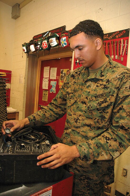 Cpl. Lewis Guy, Marine Attack Squadron 311 Individual Materials Readiness List manager and native of Killien, Texas, performs a daily inspection of a testing kit Jan. 19 in the VMA-311 hangar. IMRL gear is advanced enough that it requires its own military occupational specialty to ensure it is properly calibrated and working.