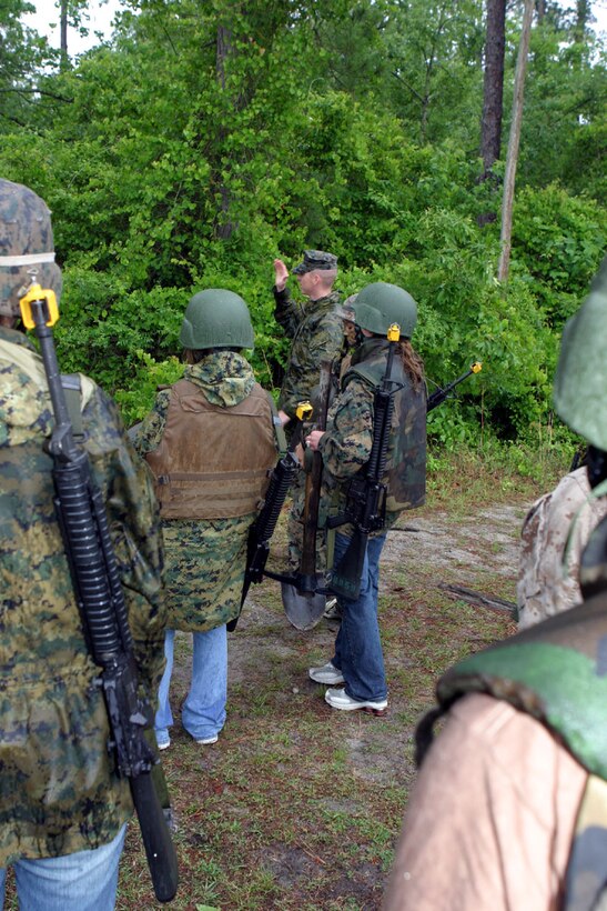 MARINE CORPS BASE CAMP LEJEUNE, N.C. (May 20) Capt John Gwazauskas, company Commander for Company C, 2nd Assault Amphibian Battalion explains how his team, team Gator will prepare their defensive positions against the offensive team, team Spearhead as part of the exercise designed for the battalion's Jane Wayne Day May 20.