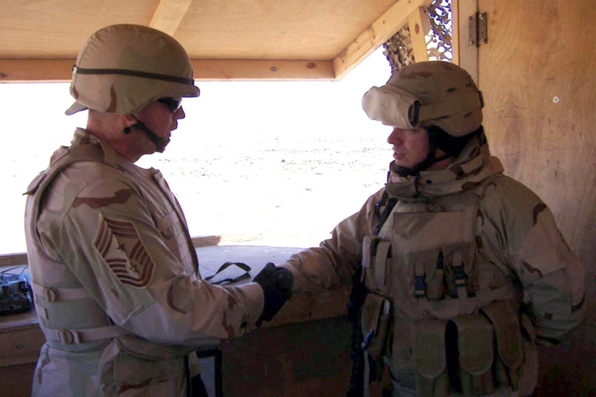 SOUTHWEST ASIA (AFPN) -- Command Chief Master Sgt. David Popp of Air Combat Command meets an Airman during his recent visit to several deployed locations here. The No. 1 reason for his visit was ensuring the troops had been properly trained and equipped before deploying. (U.S. Air Force photo by Chief Master Sgt. Brooke McLean)