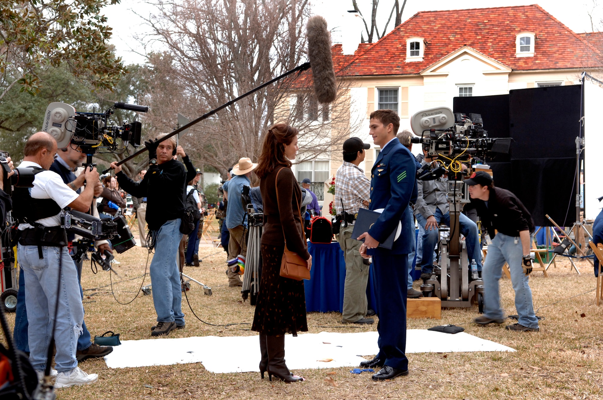 BARKSDALE AIR FORCE BASE, La. (AFPN) -- Ashton Kutcher and Shelby Fenner films a scene from the movie "The Guardian." Parts of the movie were filmed on base Jan. 12 and 13. (U.S. Air Force photo by Master Sgt. Michael Kaplan)